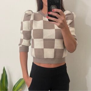 Cute cropped sweater. Bought from a boutique. New with tags.